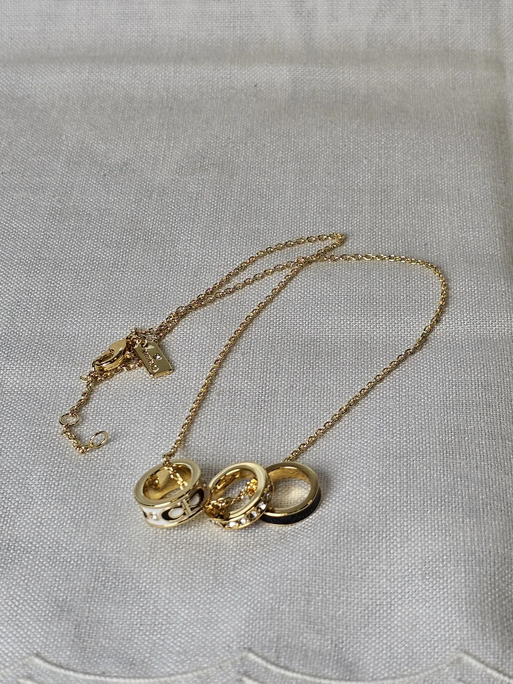 COACH Gold and Black Pendant Necklace with Crystal Accents